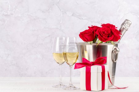 Photo for Valentines day card with champagne, rose flowers and gift box. With space for your greetings - Royalty Free Image