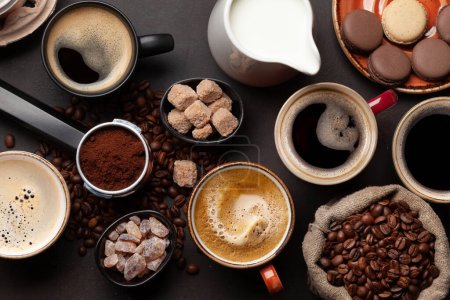 Photo for Fresh cappuccino and espresso coffee, roasted coffee beans, sugar and milk. Top view flat lay - Royalty Free Image