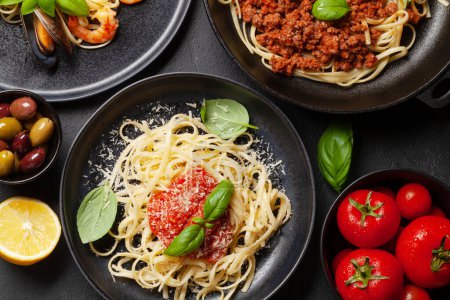 Photo for Various Italian pasta. Seafood, mushroom and tomato sauce pasta, spaghetti bolognese. Top view flat lay - Royalty Free Image