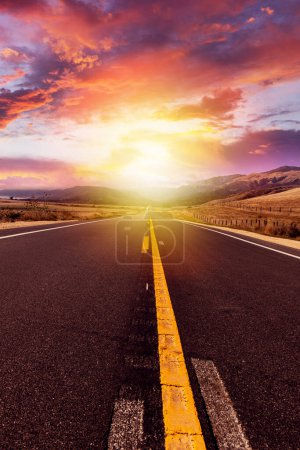 Photo for Empty asphalt road in rural landscape at sunset with dramatic sky - Royalty Free Image