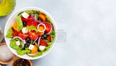 Photo for Classic greek salad with fresh garden vegetables. Top view flat lay with copy space - Royalty Free Image