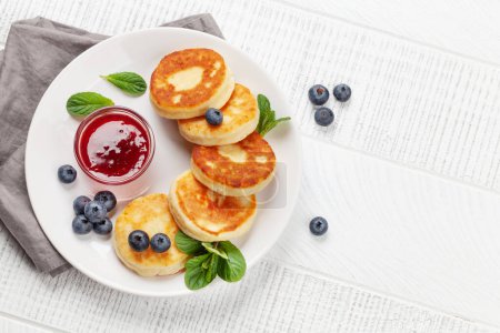 Photo for Cottage pancakes with berry jam and berries. Top view flat lay with copy space - Royalty Free Image