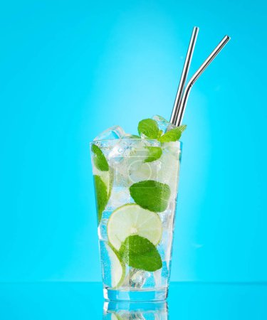 Photo for Mojito cocktail on blue background with copy space - Royalty Free Image