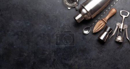 Photo for Various cocktail utensil set. Shaker, strainer, juicer. Top view flat lay with copy space - Royalty Free Image