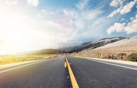 Photo for Asphalt road and country landscape with sunny sky. California State Route One - Royalty Free Image