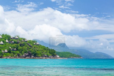 Photo for Tropical sea, mountains with palm trees and bungalows - Royalty Free Image