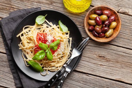Photo for Pasta with tomato sauce and basil. Top view flat lay with copy space - Royalty Free Image
