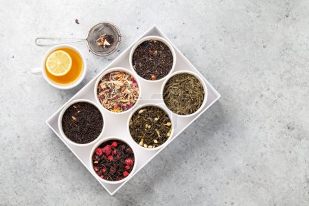 Photo for Various dried tea in box. Herbal, green and black tea leaves. Top view flat lay with copy space - Royalty Free Image