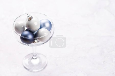 Photo for Champagne glass with Christmas bauble balls. With copy space - Royalty Free Image