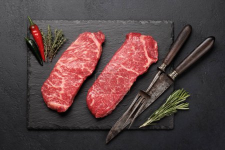 Photo for Prime marbled beef steaks. Raw striploin steak. Flat lay - Royalty Free Image