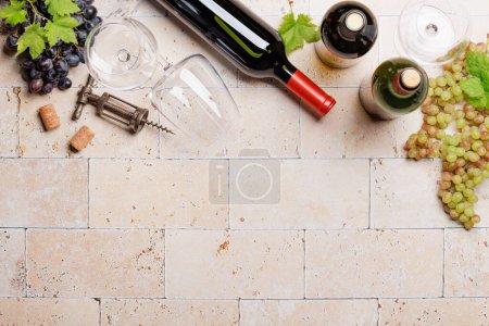 Photo for White, rose and red wine bottles and glasses. Flat lay with copy space - Royalty Free Image
