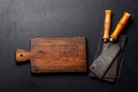 Photo for Meat butcher knifes and cutting board. Flat lay with copy space - Royalty Free Image