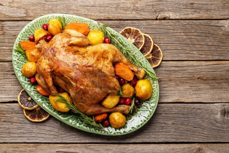 Photo for Thanksgiving turkey on rustic wooden table with copy space. Flat lay - Royalty Free Image