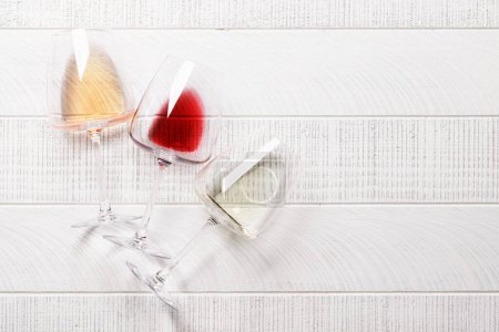 Photo for White, rose and red wine glasses. Flat lay with copy space - Royalty Free Image