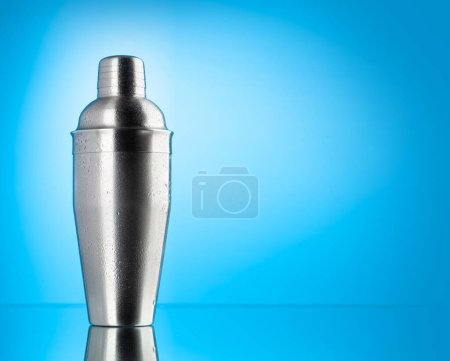 Photo for Cocktail shaker on blue background with copy space - Royalty Free Image