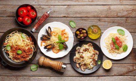 Photo for Various Italian pasta. Seafood, mushroom and tomato sauce pasta, spaghetti bolognese. Top view flat lay with copy space - Royalty Free Image