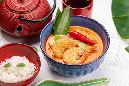 Photo for Thai Tom Yum Soup with seafood and bowl of rice - Royalty Free Image