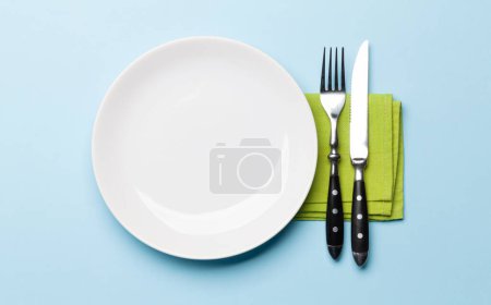 Photo for Empty plate and silverware. Top view flat lay with copy space. Template or mockup for your meal - Royalty Free Image