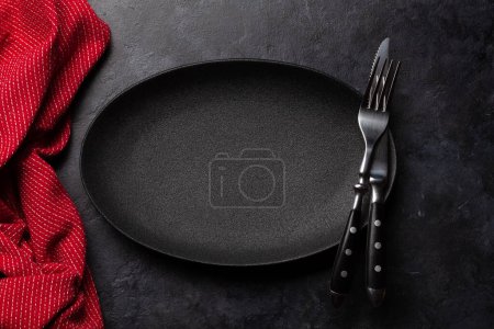 Photo for Empty plate and silverware on stone table. Top view flat lay with copy space. Template or mockup for your meal - Royalty Free Image