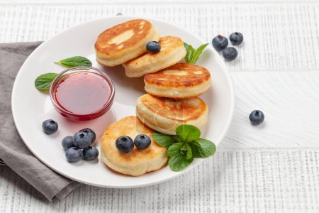Photo for Cottage pancakes with berry jam and berries - Royalty Free Image
