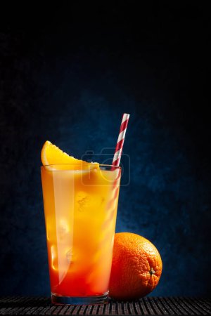 Photo for Tequila sunrise cocktail on dark background with copy space - Royalty Free Image