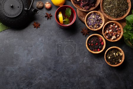 Photo for Various dried tea and teapot. Top view flat lay with copy space - Royalty Free Image