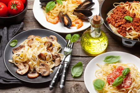 Photo for Various Italian pasta. Seafood, mushroom and tomato sauce pasta, spaghetti bolognese - Royalty Free Image