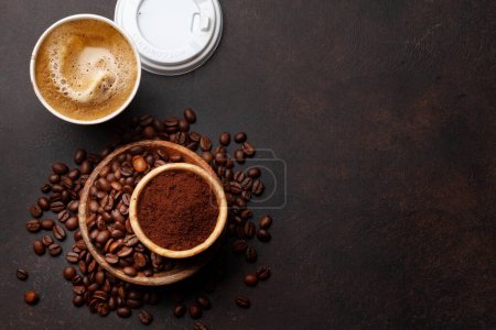 Photo for Fresh coffee in takeaway cup, roasted coffee beans and ground coffee. Top view flat lay - Royalty Free Image