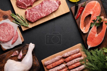 Photo for Various raw meat and fish. Steaks, sausages, salmon, chicken and spices. Flat lay with copy space - Royalty Free Image