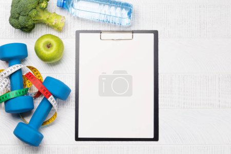 Photo for Fitness and healthy diet concept. Flat lay with clipboard for your fitness plan or diet menu - Royalty Free Image