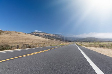 Photo for Asphalt road and country landscape - Royalty Free Image