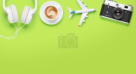 Photo for Travel and vacation concept. Coffee and airplane on green desk with copy space - Royalty Free Image