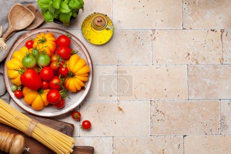 Photo for Various colorful garden tomatoes. Fresh vegetables and spices. Top view flat lay with copy space - Royalty Free Image