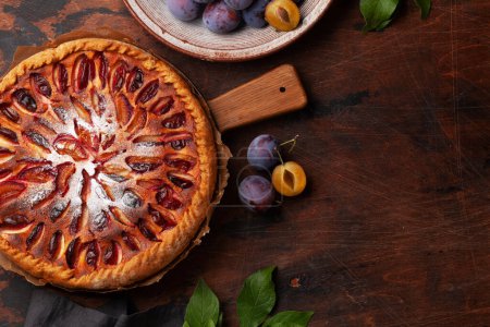 Photo for Homemade plum pie. Fruit tart with seasonal fruits. Flat lay with copy space - Royalty Free Image