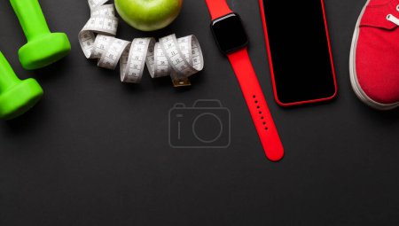 Photo for Sneakers, smartphone, watch and dumbbells. Sport, fitness and healthy lifestyle background. Top view flat lay with copy space - Royalty Free Image