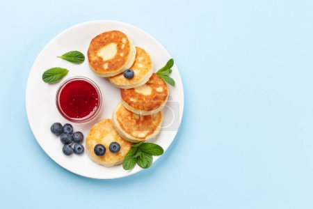 Photo for Cottage pancakes with berry jam and berries. Top view flat lay with copy space - Royalty Free Image