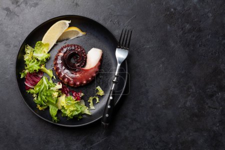 Photo for Grilled octopus and salad. Top view flat lay with copy space - Royalty Free Image
