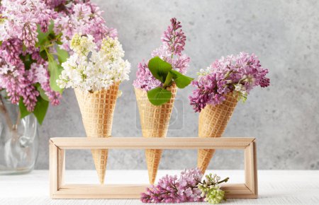Photo for Various lilac flowers in ice cream cones. Spring concept - Royalty Free Image