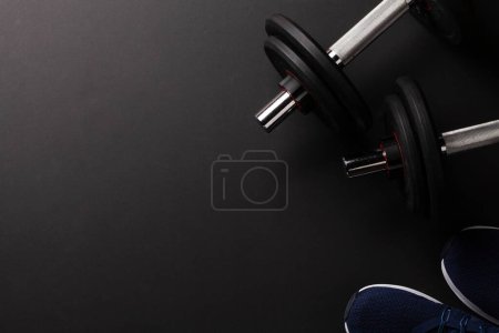 Photo for Sneakers and dumbbells. Sport, fitness and healthy lifestyle background. Top view flat lay with copy space - Royalty Free Image