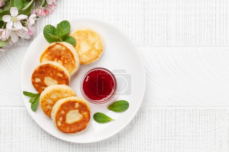 Photo for Cottage pancakes with berry jam. Top view flat lay with copy space - Royalty Free Image