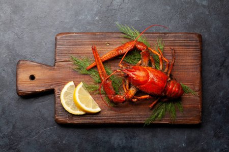 Photo for Boiled crayfish with dill and lemon. Top view flat lay - Royalty Free Image
