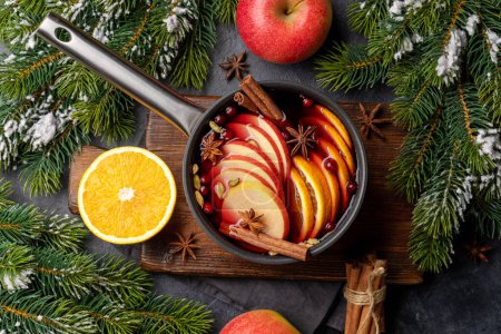 Photo for Hot mulled wine with fruits and spices. Flat lay - Royalty Free Image