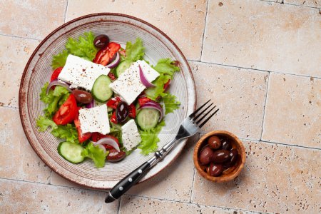 Photo for Greek salad with fresh vegetables and feta cheese. Flat lay with copy space - Royalty Free Image