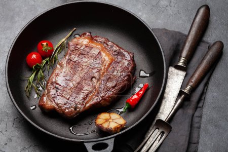 Photo for Grilled ribeye beef steak in frying pan - Royalty Free Image