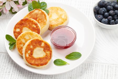 Photo for Cottage pancakes with berry jam and berries - Royalty Free Image