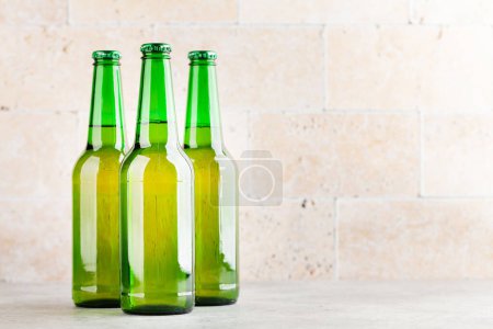 Photo for Three beer bottles. With copy space - Royalty Free Image