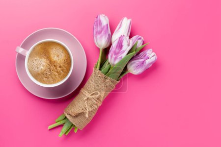 Photo for Purple tulip flowers bouquet and coffee cup on pink background. Flat lay with copy space - Royalty Free Image