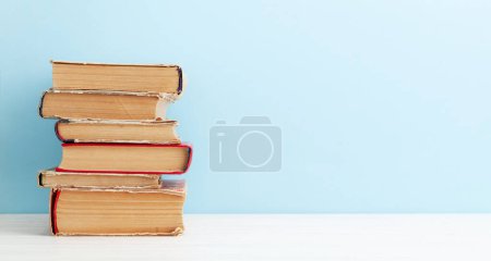 Photo for Old books on wooden table and copy space. School and education template - Royalty Free Image