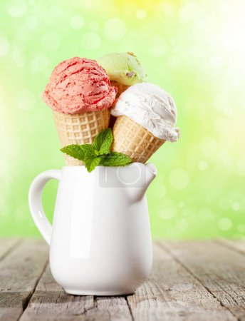 Photo for Various ice cream in waffle cones. Strawberry, pistachio and vanilla icecream - Royalty Free Image