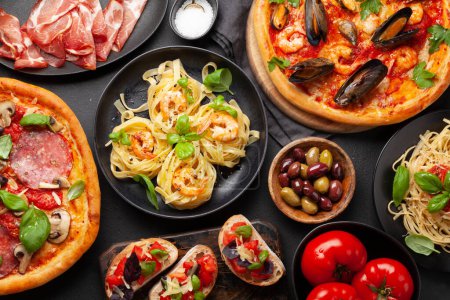 Photo for Italian cuisine. Pasta, pizza, olives and antipasto toasts. Flat lay - Royalty Free Image